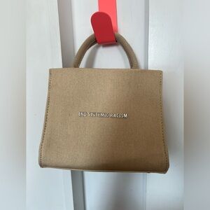 Brandon Blackwood NWOT END SYSTEMIC RACISM beige mini purse